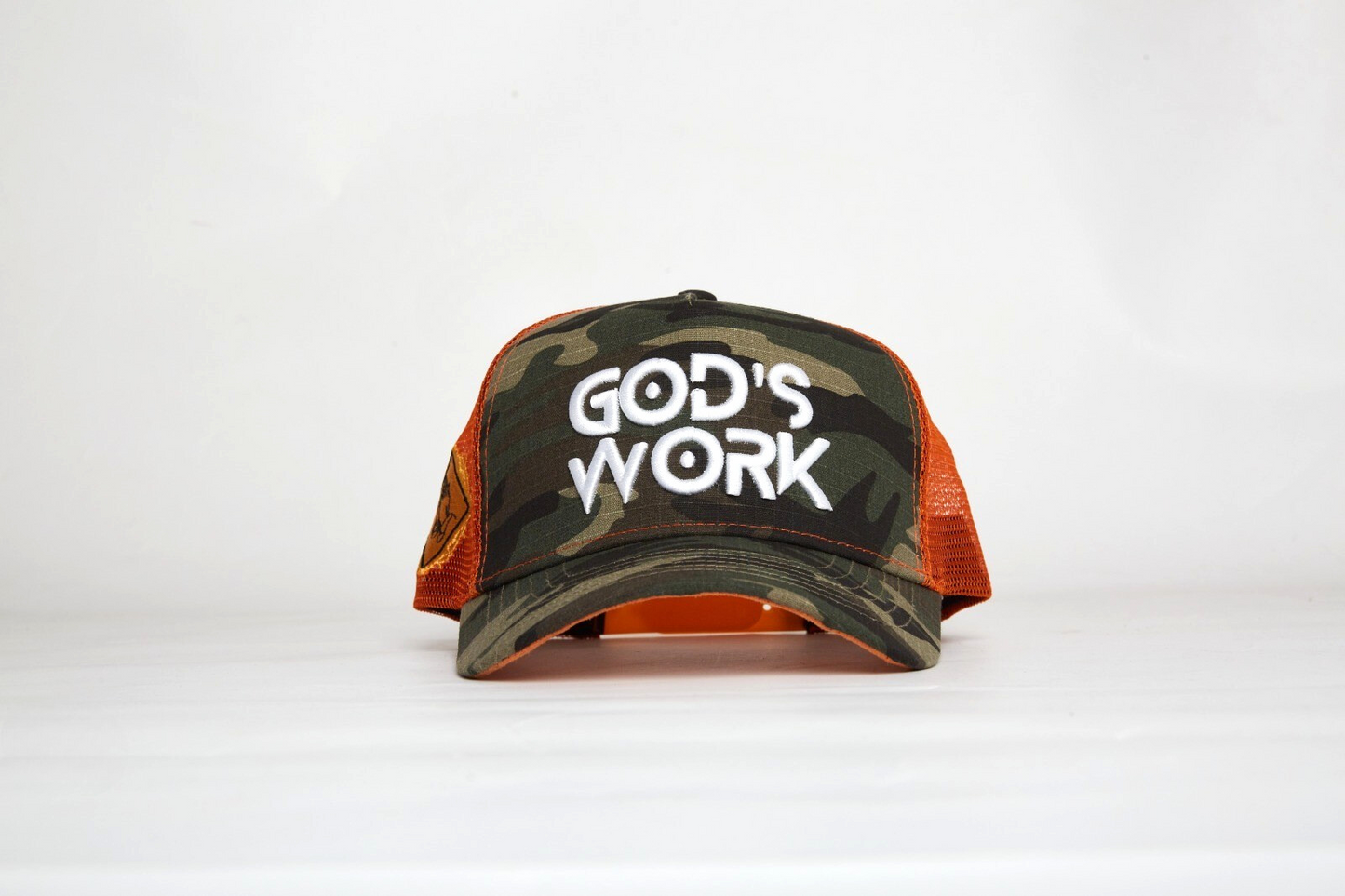 God’s Work- Signature Series Camo/Orange Mesh Snap-back Proclaim Clothing.